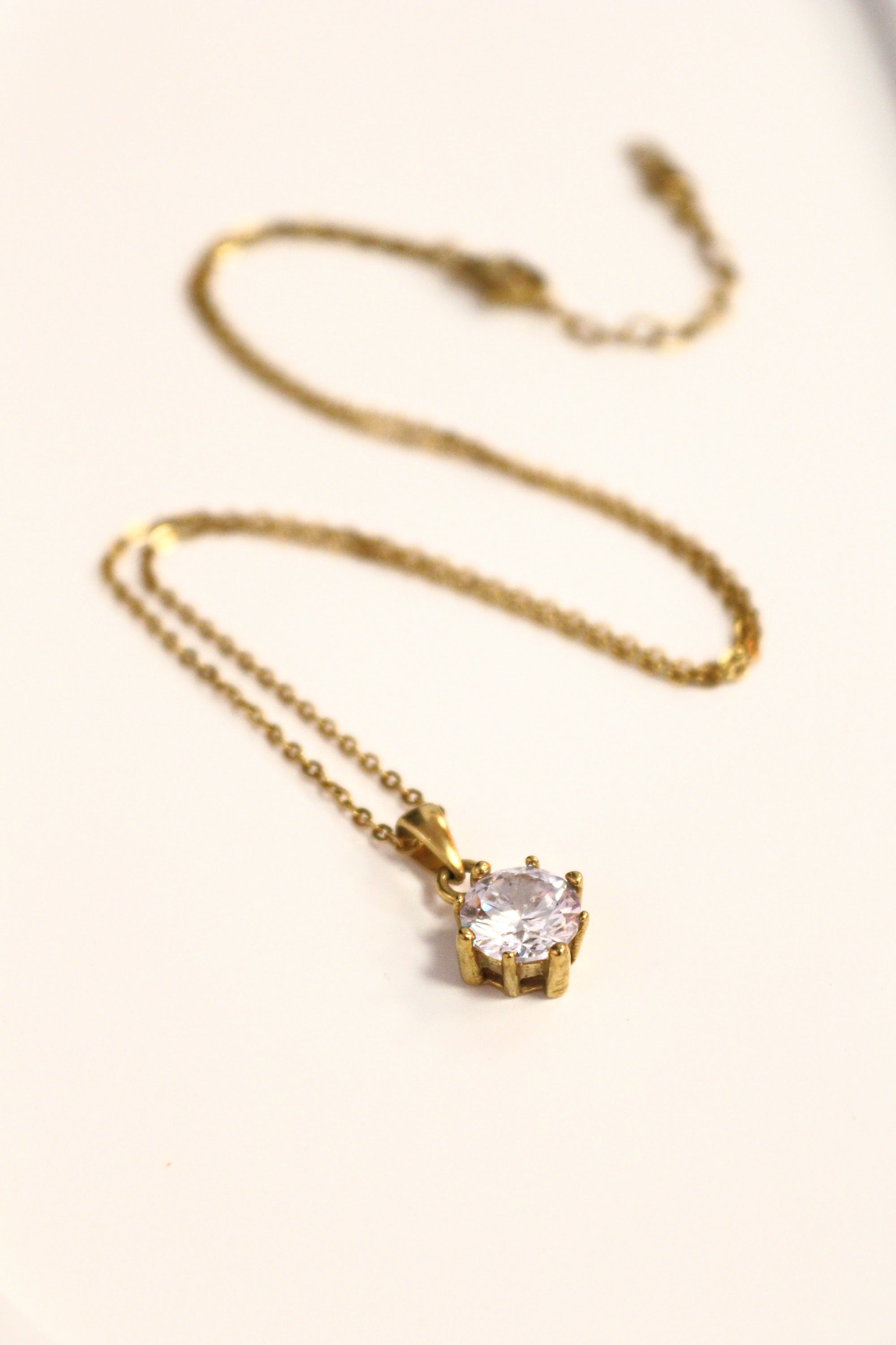 7. Emerald Hexagon Gold Necklace