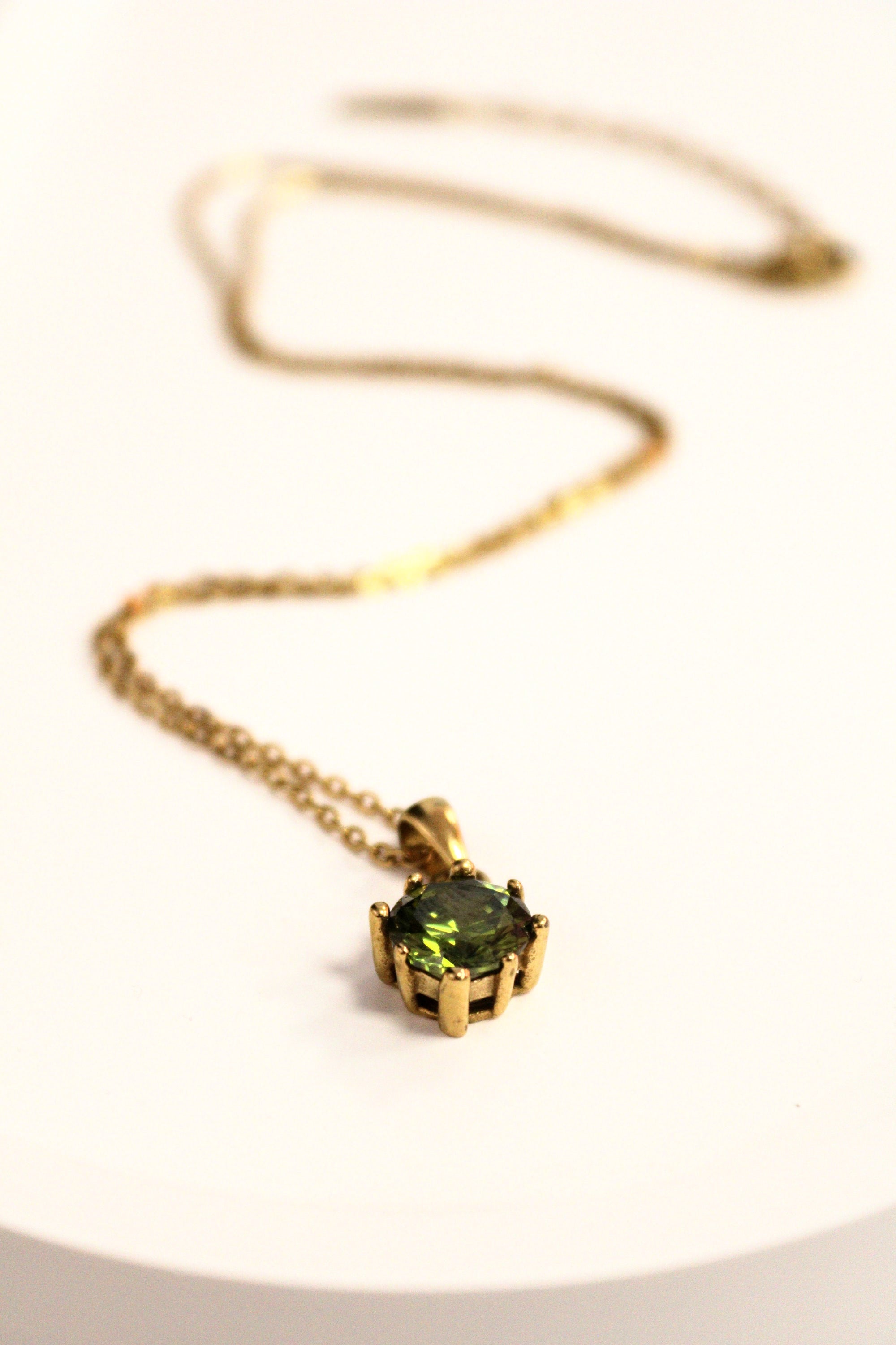 7. Emerald Hexagon Gold Necklace